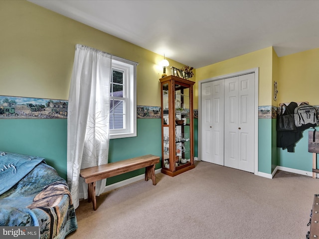 carpeted bedroom with a closet