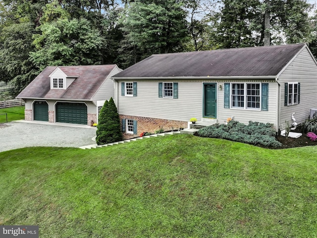 view of front facade with a garage and a front lawn