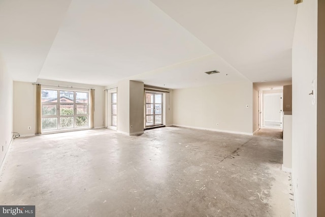 unfurnished room featuring a healthy amount of sunlight