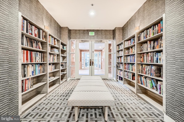 unfurnished room featuring carpet floors and french doors