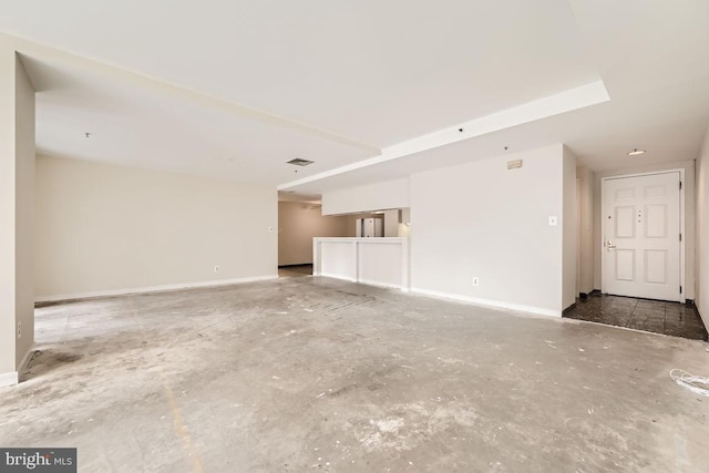 spare room with concrete floors