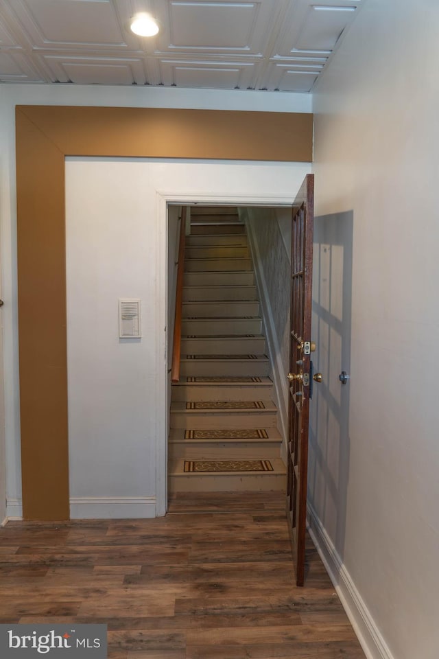 staircase featuring hardwood / wood-style flooring