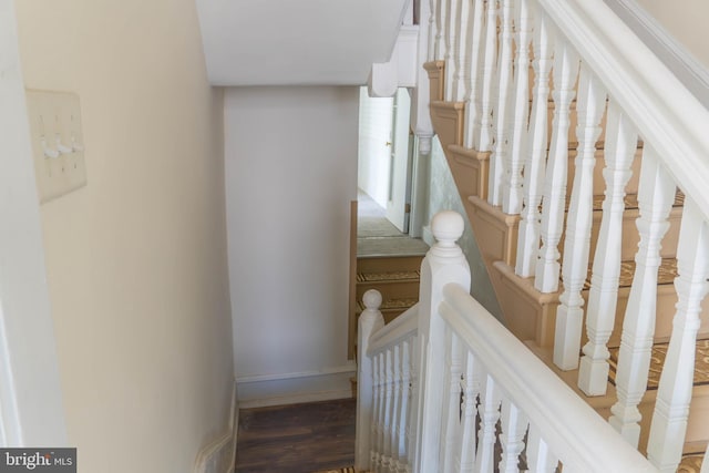 stairs with wood-type flooring