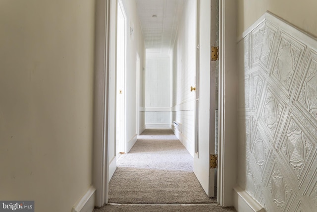 hallway with carpet flooring