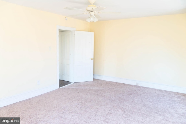 unfurnished room featuring carpet and ceiling fan