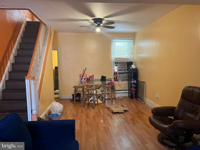 interior space featuring hardwood / wood-style floors and ceiling fan