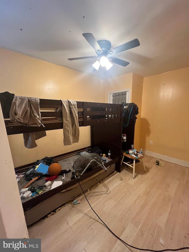 bedroom featuring hardwood / wood-style flooring and ceiling fan