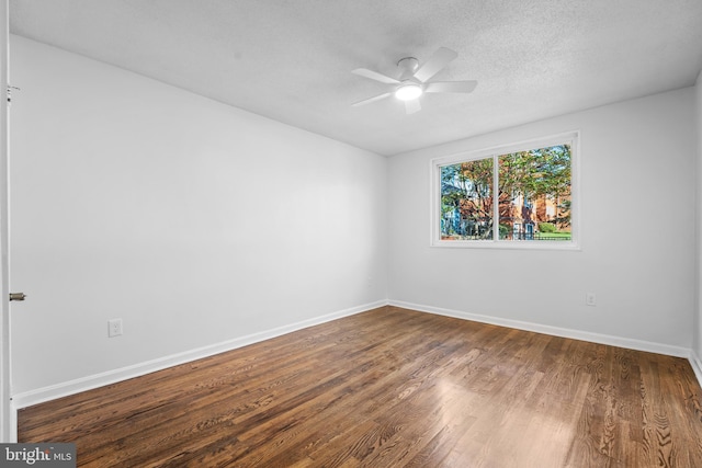 spare room featuring a textured ceiling, hardwood / wood-style flooring, and ceiling fan