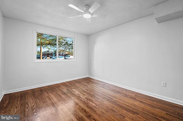 spare room featuring a textured ceiling, hardwood / wood-style flooring, and ceiling fan