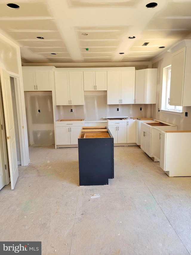 kitchen featuring white cabinetry and a kitchen island