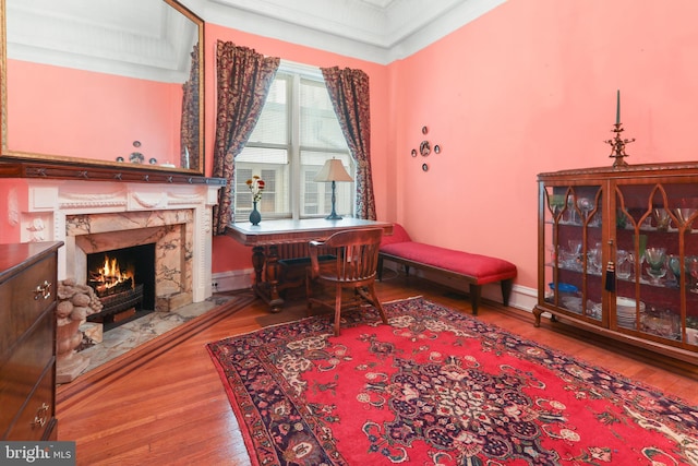 living area with a fireplace and hardwood / wood-style floors