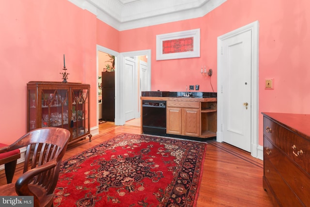 interior space with light wood-type flooring and black appliances