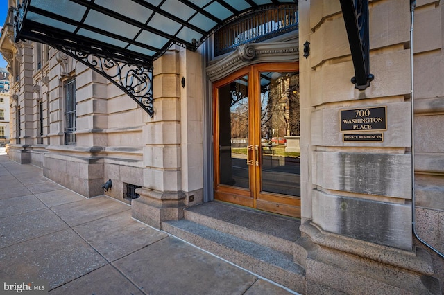 view of exterior entry featuring french doors