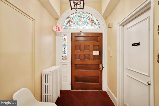 foyer featuring radiator heating unit