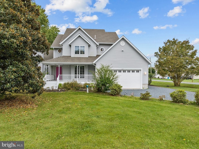 view of front of house with a garage, a front lawn, and a porch