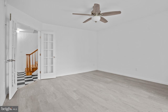 unfurnished room with light hardwood / wood-style flooring, french doors, and ceiling fan