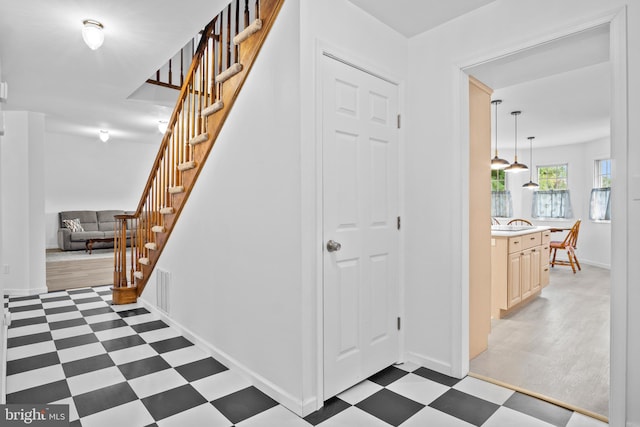 stairs featuring wood-type flooring