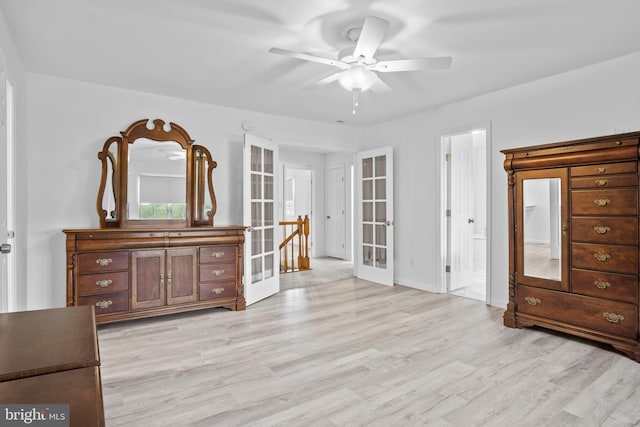 interior space featuring french doors, ceiling fan, and light hardwood / wood-style flooring