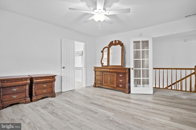 bedroom with a closet, ceiling fan, and light hardwood / wood-style flooring