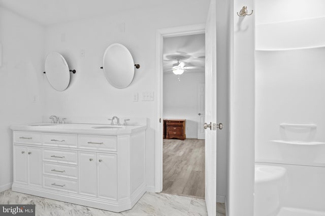 bathroom featuring vanity, wood-type flooring, and ceiling fan