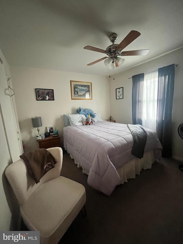 carpeted bedroom with ceiling fan