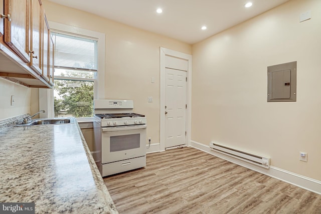 kitchen with electric panel, sink, light hardwood / wood-style flooring, a baseboard heating unit, and white gas range