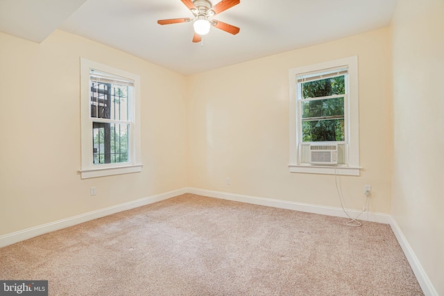 unfurnished room with ceiling fan, cooling unit, and carpet