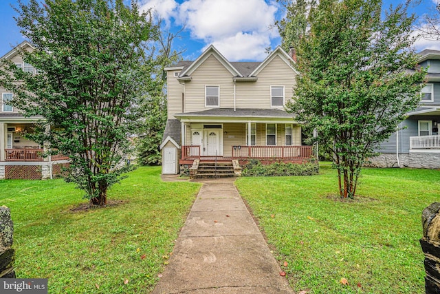 view of front of house featuring a front yard and a wooden deck