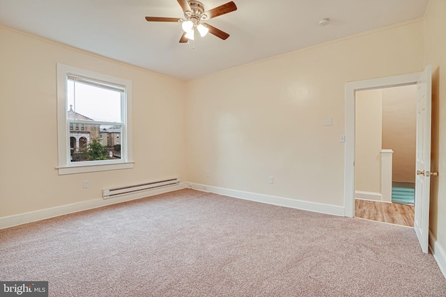 carpeted spare room with ceiling fan, ornamental molding, and a baseboard radiator