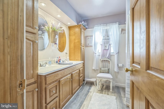 bathroom with wood-type flooring and vanity