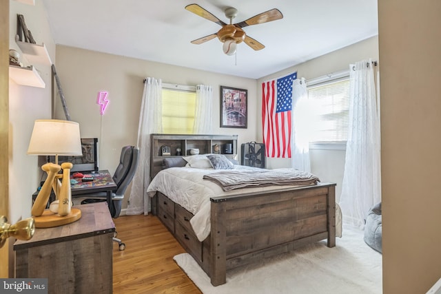 bedroom featuring ceiling fan and light hardwood / wood-style flooring