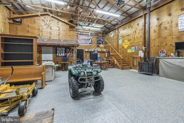 miscellaneous room with high vaulted ceiling