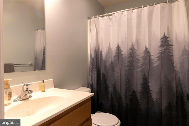 bathroom featuring vanity and toilet