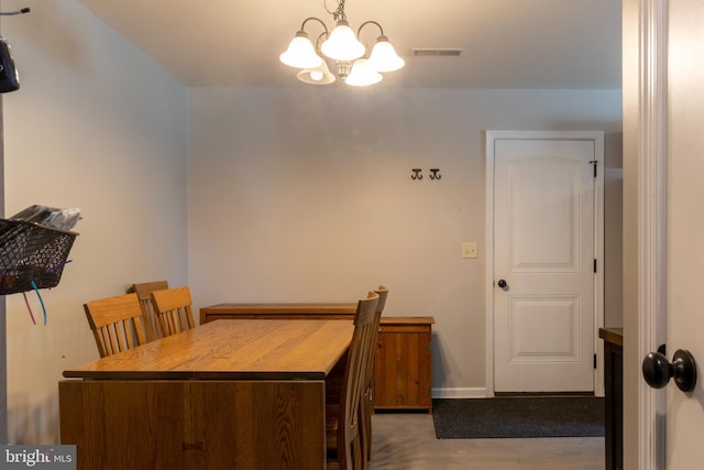 dining area featuring a chandelier