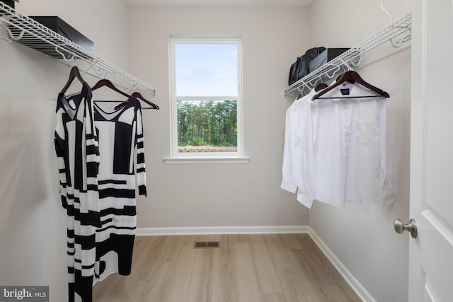 spacious closet featuring light wood-type flooring