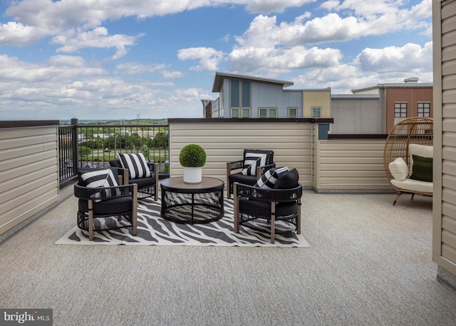 view of patio / terrace with a balcony