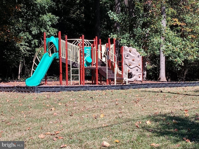 view of jungle gym with a lawn