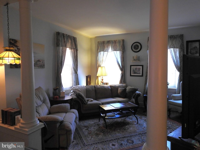 living room with decorative columns