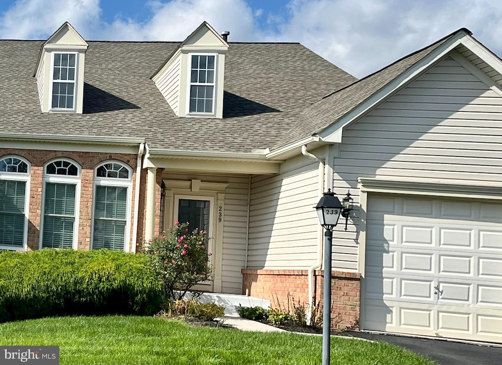 view of exterior entry with a garage