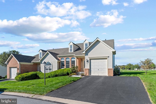 view of front facade with a garage and a front lawn