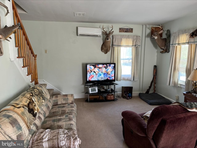 carpeted living room with a wall unit AC and a wealth of natural light