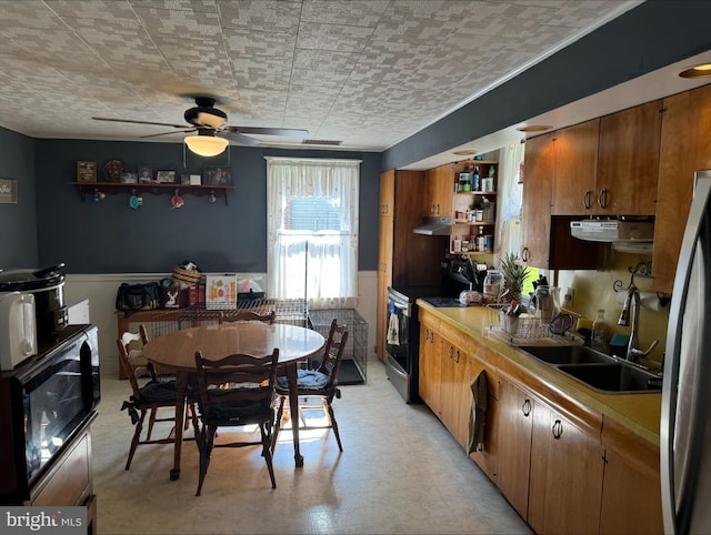 kitchen featuring black appliances, sink, and ceiling fan