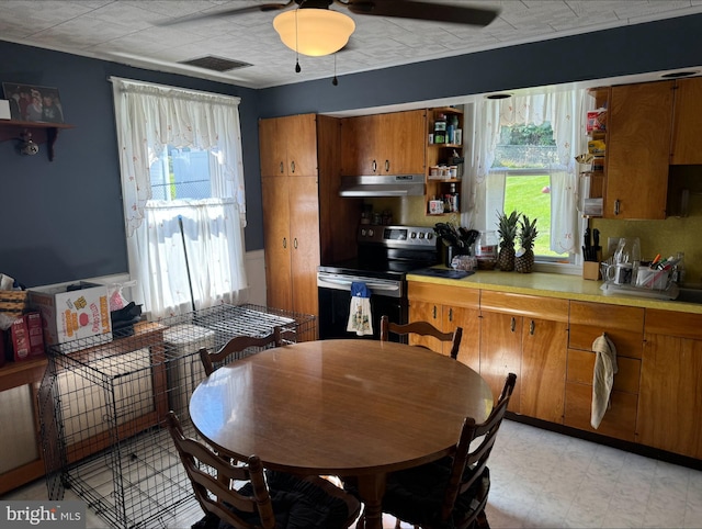 dining space featuring ceiling fan