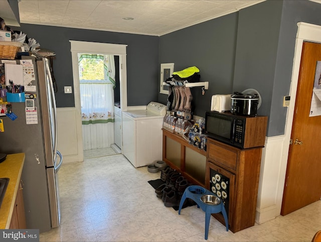 laundry area with washing machine and dryer