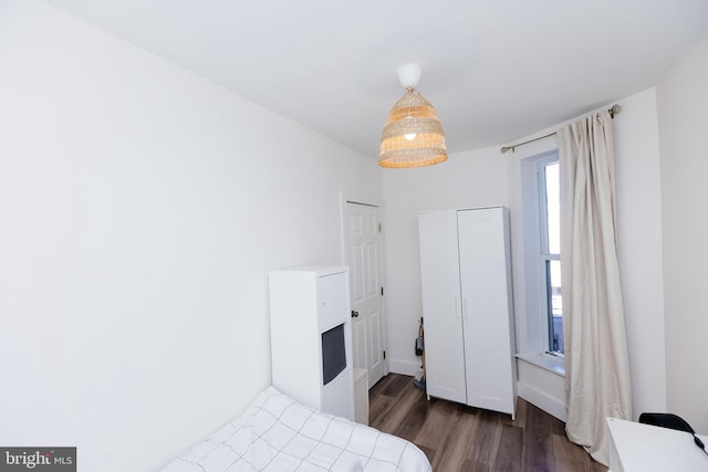 bedroom featuring dark hardwood / wood-style floors