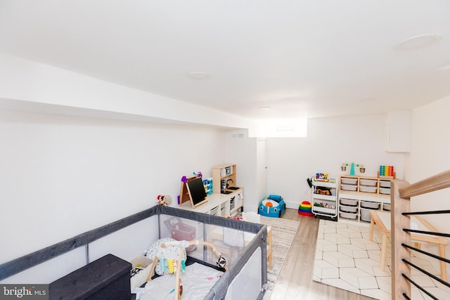 recreation room featuring light hardwood / wood-style flooring