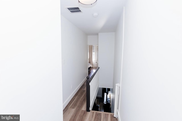 stairway featuring hardwood / wood-style floors