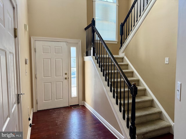 foyer featuring dark wood-type flooring