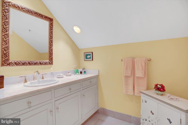 373 Craig Rd, Greencastle, PA 17225 - bathroom with baseboards, vaulted ceiling, tile patterned floors, and vanity