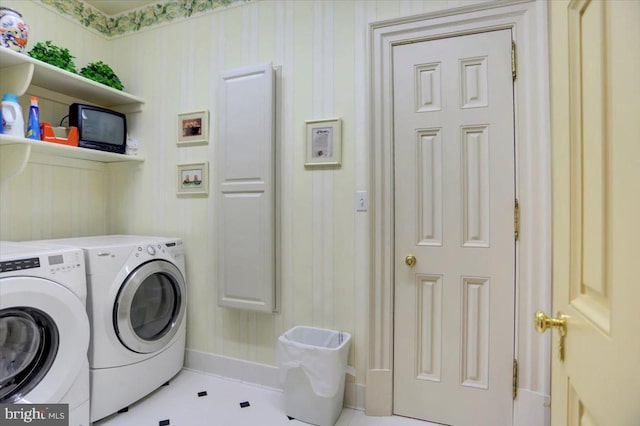 washroom with independent washer and dryer and light tile patterned floors